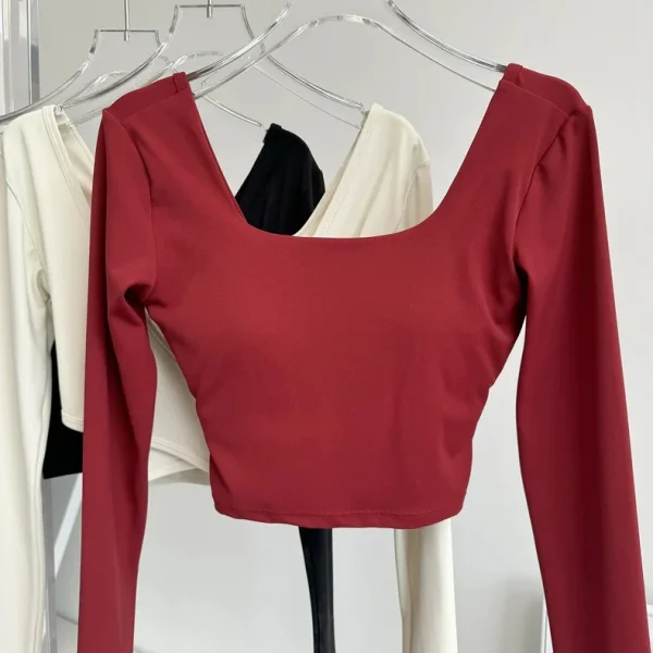 منصات الصدر الثابتة عبرت الظهر ملابس اليوغا ضيقة التخسيس الرياضة بأكمام طويلة تشغيل بولا اللياقة البدنية الملابس بلايز قمصان