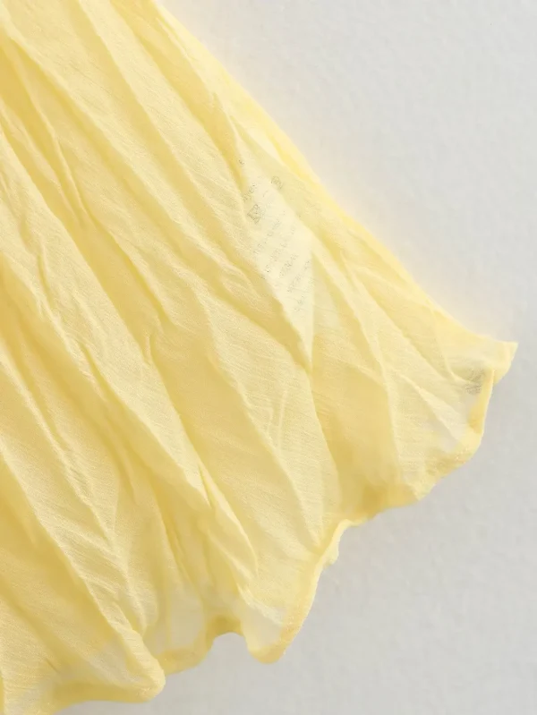 تنورة YENKYE للسيدات مجعدة على شكل حرف a ميدي باللون الأصفر والزبدة بخصر مطاطي تنانير أنيقة لعطلات الربيع والصيف جديدة 2025 faldas mujer