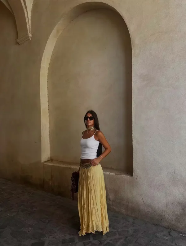 تنورة YENKYE للسيدات مجعدة على شكل حرف a ميدي باللون الأصفر والزبدة بخصر مطاطي تنانير أنيقة لعطلات الربيع والصيف جديدة 2025 faldas mujer