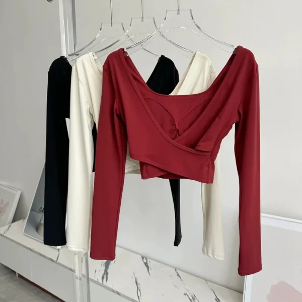 منصات الصدر الثابتة عبرت الظهر ملابس اليوغا ضيقة التخسيس الرياضة بأكمام طويلة تشغيل بولا اللياقة البدنية الملابس بلايز قمصان