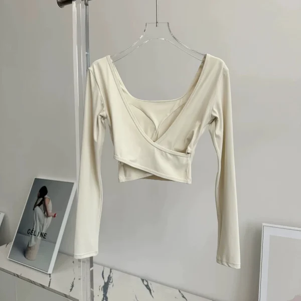 منصات الصدر الثابتة عبرت الظهر ملابس اليوغا ضيقة التخسيس الرياضة بأكمام طويلة تشغيل بولا اللياقة البدنية الملابس بلايز قمصان