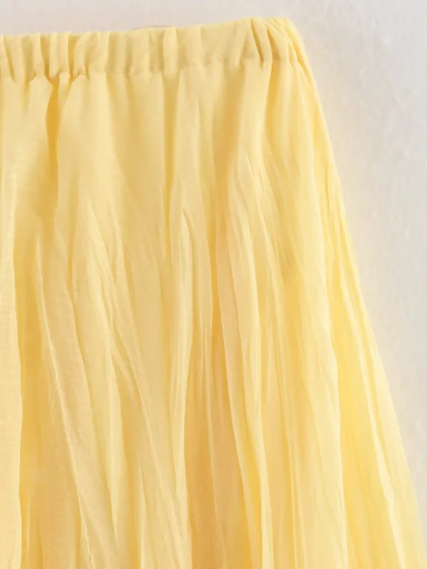 تنورة YENKYE للسيدات مجعدة على شكل حرف a ميدي باللون الأصفر والزبدة بخصر مطاطي تنانير أنيقة لعطلات الربيع والصيف جديدة 2025 faldas mujer